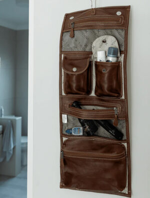 Roll up toiletry bag in use outside bathroom