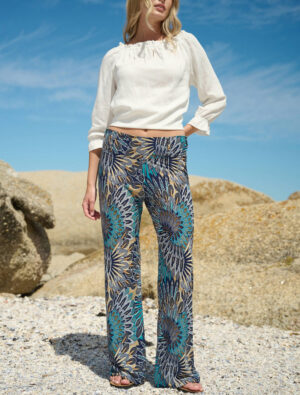 Front view of the Monica Swirl Lycra Pants on model, showing the vibrant blue swirl print and comfortable fit.