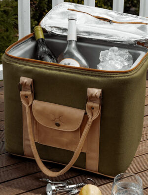 Open leather and canvas cooler bag with products inside.